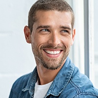 a man in Lewisville smiling after wearing Invisalign 