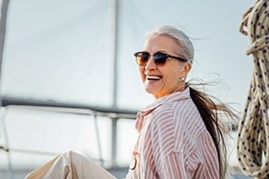 Smiling older woman enjoying time outdoors