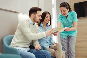 Office admin helping patients understand their dental insurance