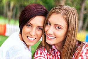 Two woman with gorgeous smiles following teeth whitening