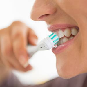 person brushing their teeth