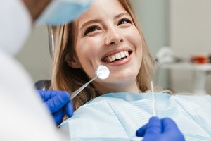 person getting their teeth checked by their dentist