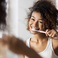 Woman brushing her teeth