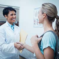 Emergency dentist in Lewisville shaking hands with a patient