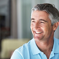 Older man with dental implants in Lewisville smiling