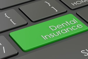 Green dental insurance button on keyboard