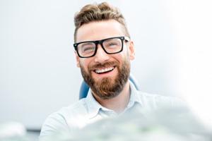 Smiling man in dentist’s chair