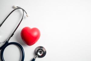 Stethoscope next to heart shape, illustrating importance of overall health
