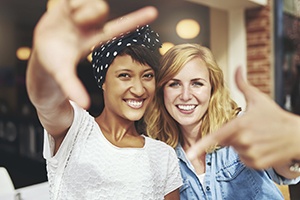 Two young women smiling