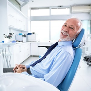 a patient smiling before undergoing dental implant salvage