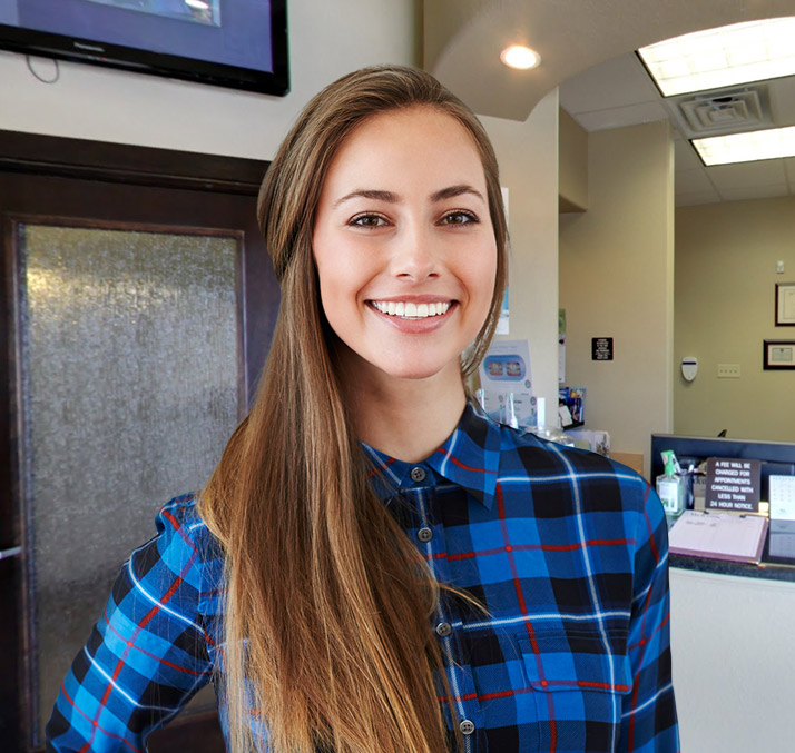 Smiling woman in blue plaid shirt