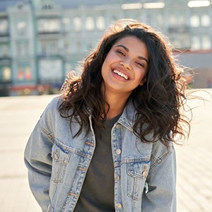 Lady smiles outdoors