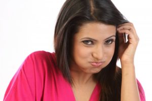 A woman rinsing her mouth.