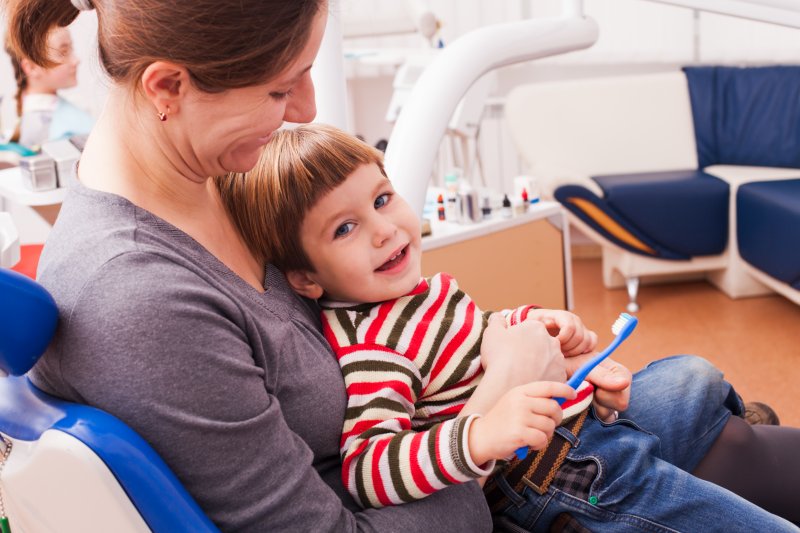 mother and child in dentist chair