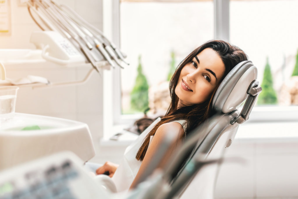 Woman at appointment with dentist in Lewisville