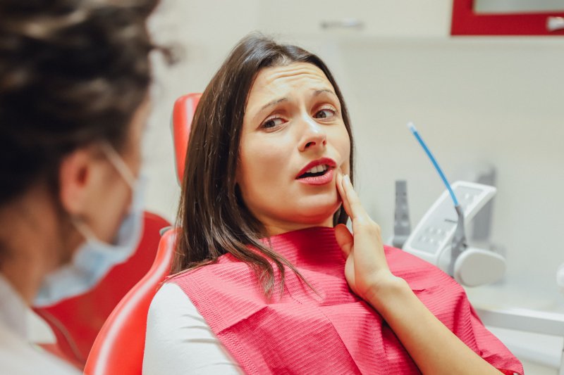 Woman with loose tooth