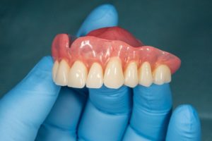 holding dentures